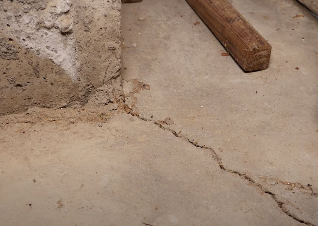 Concrete wall crack getting fixed by contractor